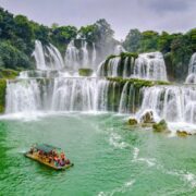 Tourist boat visiting Ban Gioc waterfalls in Cao Bang, Vietnam