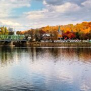 Bridge over Delaware River backdropped by fall foliage in New Hope, PA