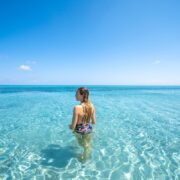 Woman in crystal-clear waters in Sardinia
