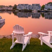 Adirondack chairs along waterfront of Mystic, CT