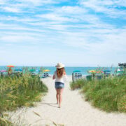 Woman walking toward beach in Myrtle Beach, SC