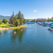 Kayakers enjoy a sunny summer day on Sand Creek alongside the marina and downtown at Lake Pend Oreille in Sandpoint, Idaho.