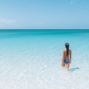 Woman walking into the ocean in South Caicos