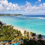 Breathtaking View of Tumon Bay with Clear Blue Waters and Palm Trees in Guam