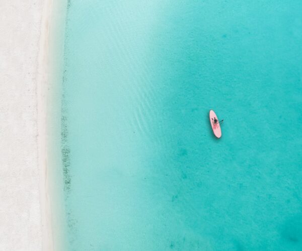 10 Beaches With the Clearest Water in the Caribbean, From Turks and Caicos to Aruba and the Cayman Islands