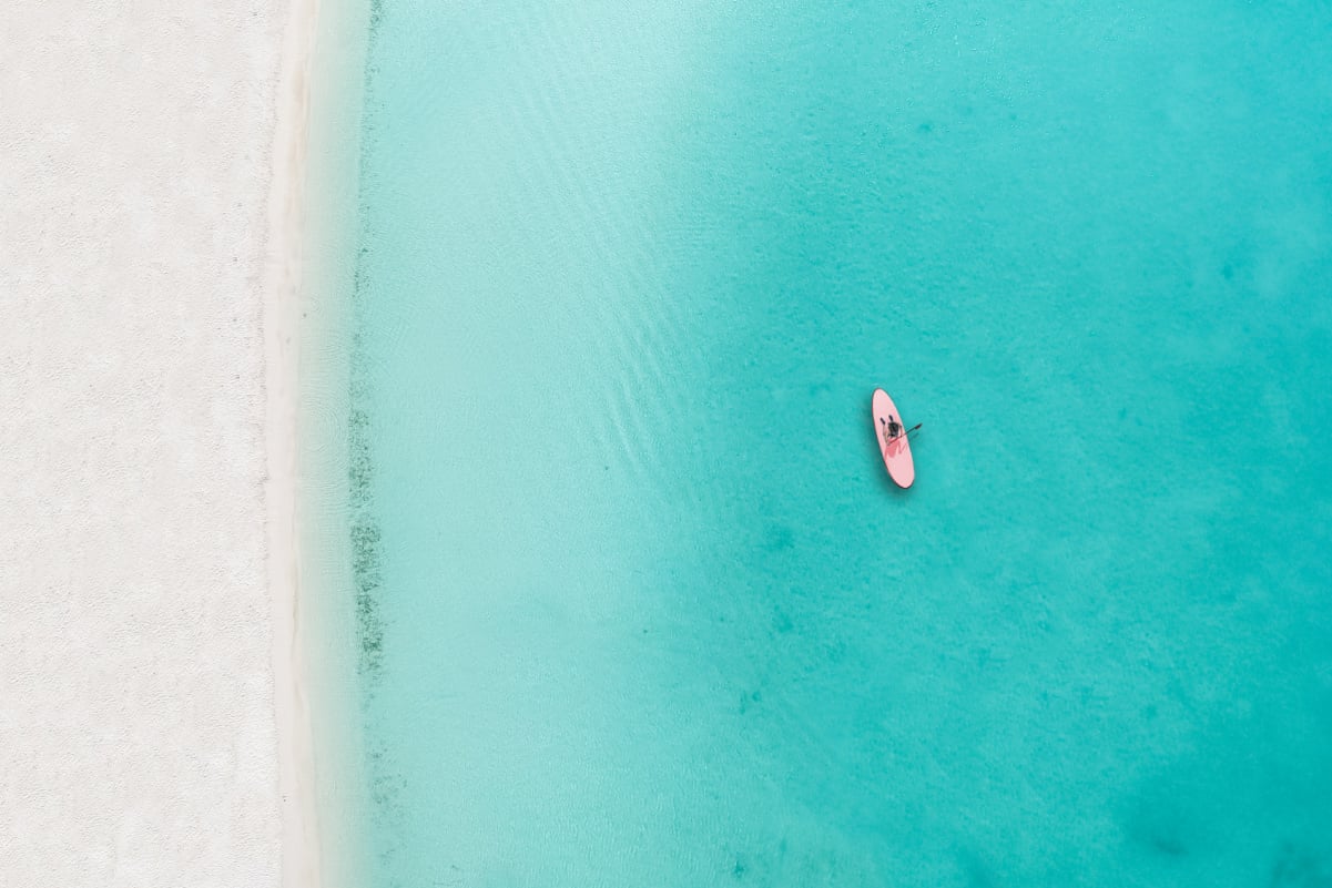 10 Beaches With the Clearest Water in the Caribbean, From Turks and Caicos to Aruba and the Cayman Islands